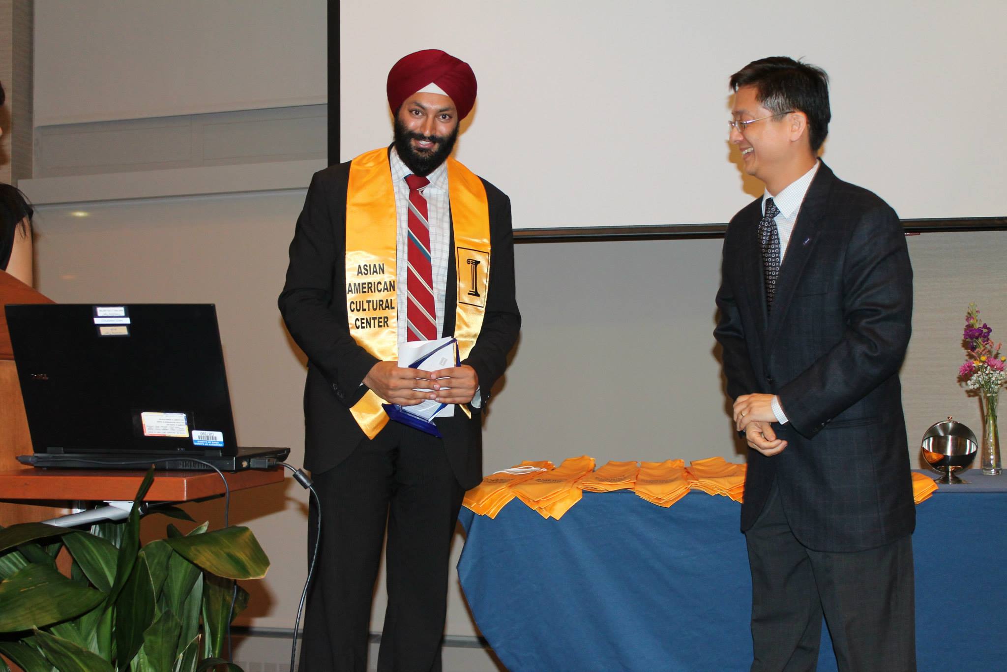 AACC alum receiving award from Director Chih