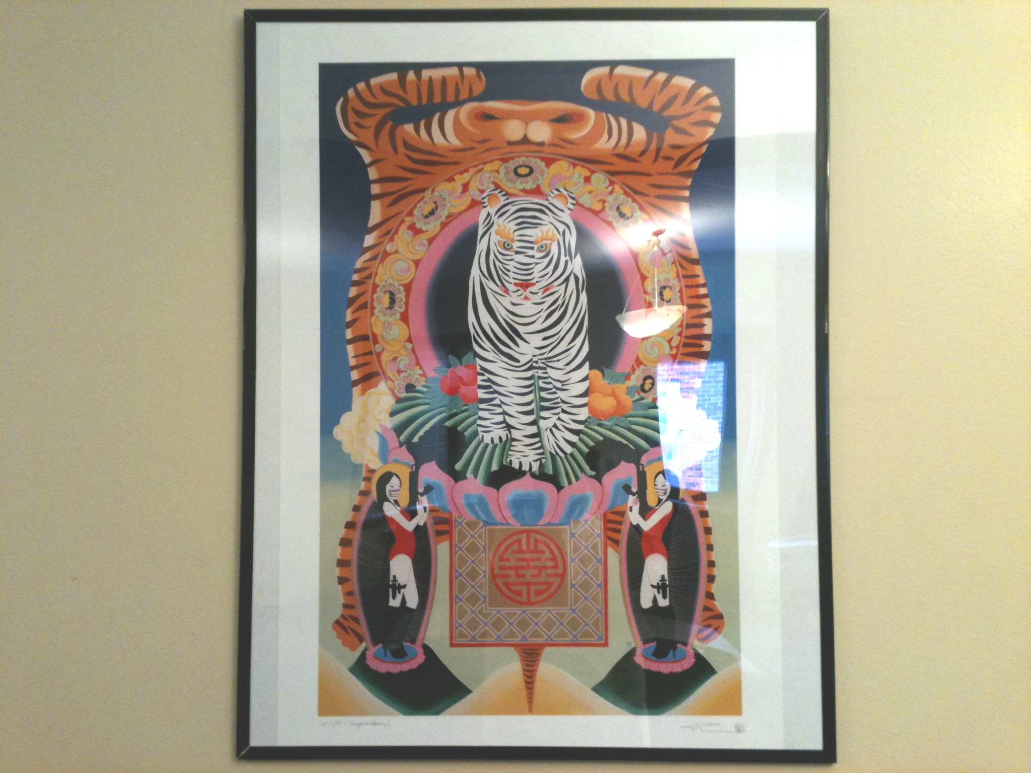 Painting of symmetrical pattern featuring tigers and figures