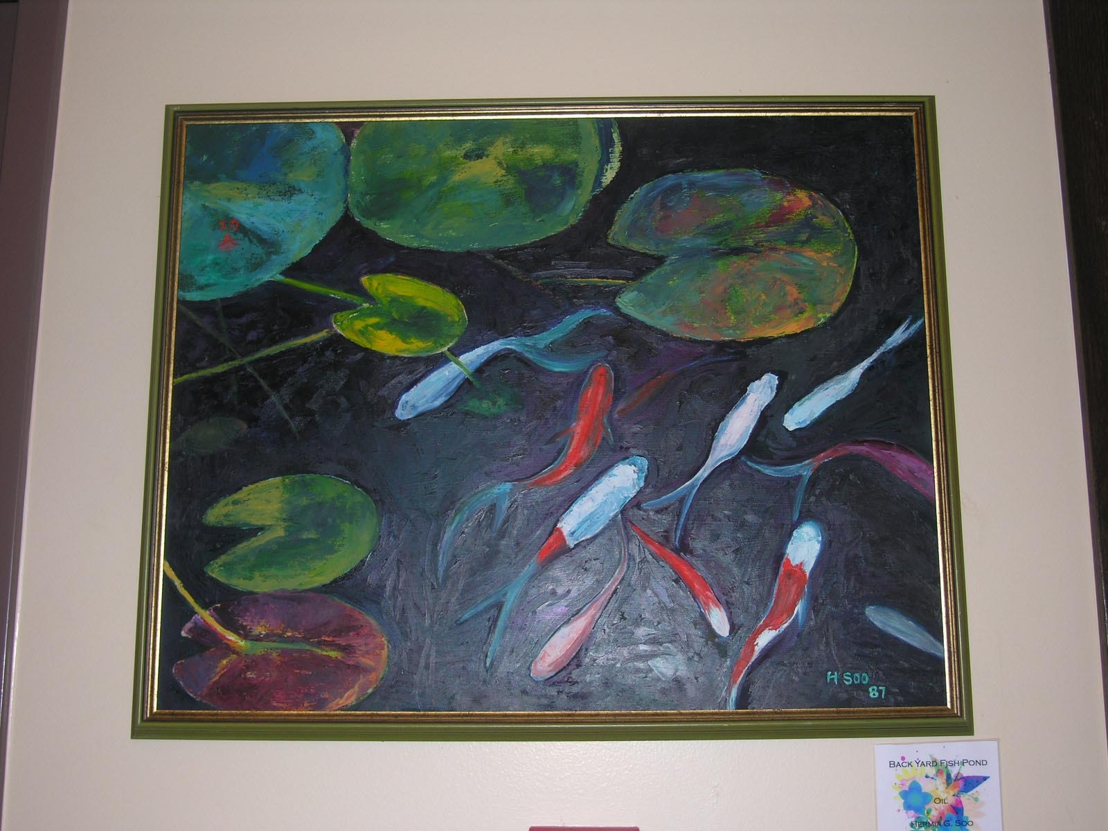 Painting of overhead view of koi fish and lilly pads in pond